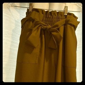 Green belted pants.